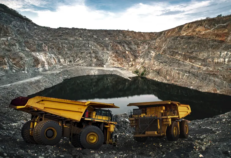 Haul trucks loading at a Nevada open-pit mine