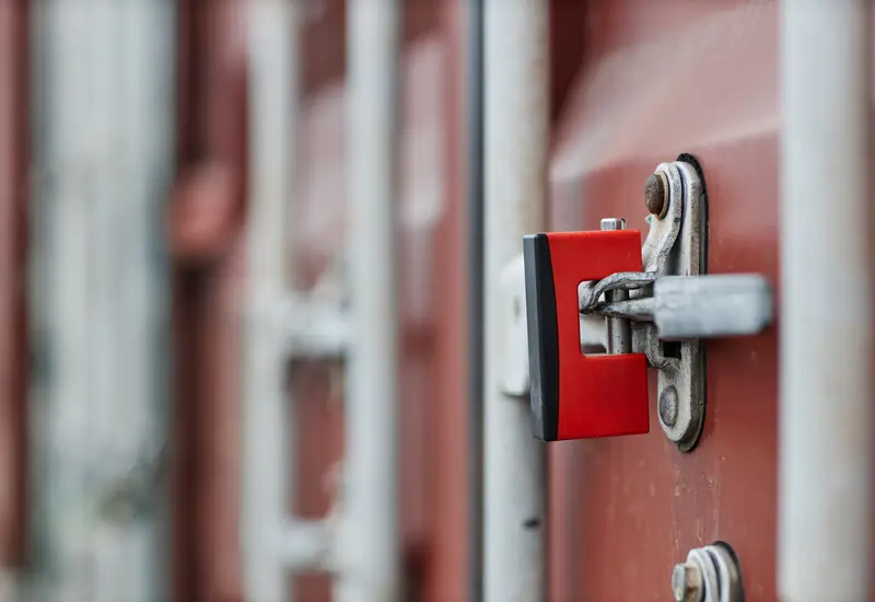 The locking rod and hasp on a container door, close up